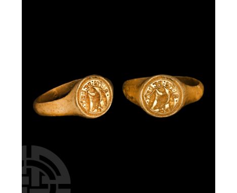 14th-15th century A.D. Gold hoop and discoid bezel with incuse ropework border; incuse image of a bird of prey perching with 