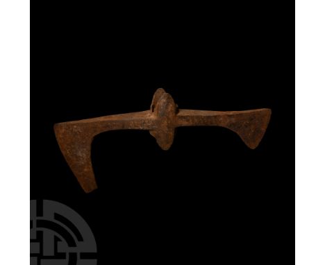 11th-14th century A.D. Composed of a central circular socket with flanges, one head with extended lower blade, the other with
