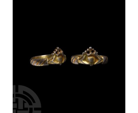 Circa 1400-1550 A.D. With twisted-band detailing to the hoop, bezel formed as two hands supporting a heart and a crown with o