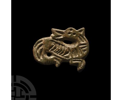 6th century A.D. Formed as a hippocampus with s-shaped body, central band of chip-carved zigzags, triangular ear and chevron 
