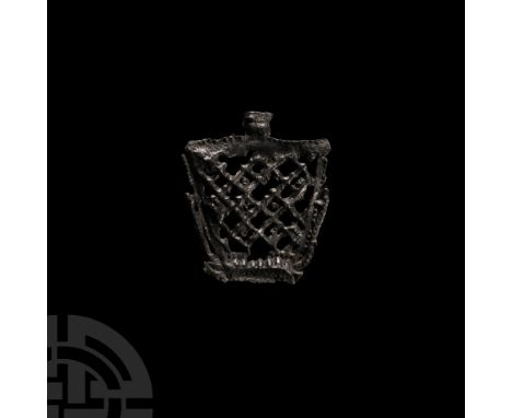 15th century A.D. Comprising a trapezoidal frame with latticework and tab to the long edge; from a purse pendant. Cf. Spencer
