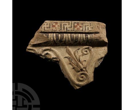 5th-4th century B.C. A fragment of amorphous form, decorated in relief with scrolling tendrils and anthemion, painted egg-and