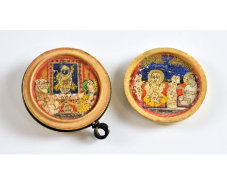 Three Indian miniatures in an ivory pendant box frame. 3.5cm diaPLEASE NOTE: THIS ITEM CONTAINS OR IS MADE OF IVORY. Buyers m
