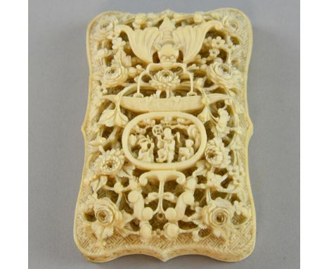 19th century Chinese ivory card case deeply carved with a bat, flowers and precious objects on one side and a scholar in a ga