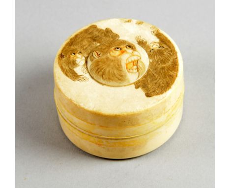 Early 20th century Japanese carved ivory circular box and cover decorated with monkeys chasing butterflies, 6.5cm diameter,PL