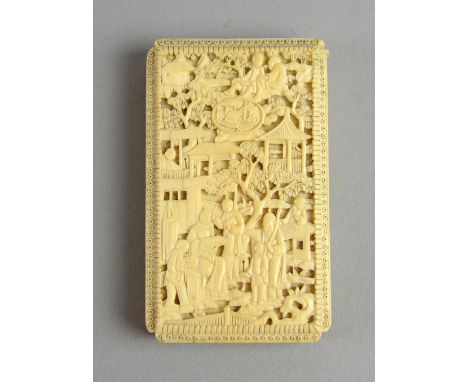 Early 20th century Chinese ivory relief carved card case with figures in a landscape setting, 9cm x 5.5cm, and a small carved