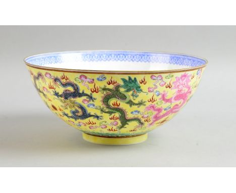 20th century Chinese yellow ground bowl decorated with flowers and foliage, on round foot, 25cm diameter, and a modern yellow