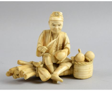 Early 20th century Japanese carved ivory okimono of a man seated on a bundle of sticks slicing fruit, signed to base, 10.5cm 