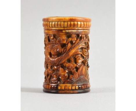 Early 20th century Chinese carved ivory pot and cover with relief decoration of dragons and flowers, 5.5cm high,PLEASE NOTE: 