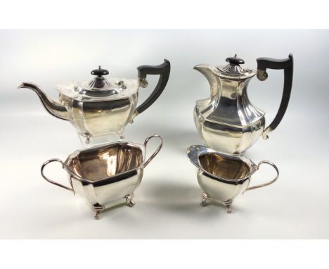 Late George V four piece tea set comprising teapot, hot water jug, H.23.5cm overall (marks rubbed), both with ebonised handle