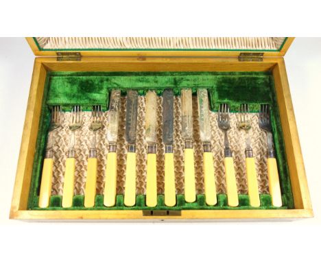 Set of 12 dessert knives and forks with silver ferrules and ivorine handles, in an oak canteen box, a quantity of silver plat