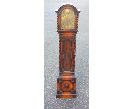 George V longcase clock with a brass dial enclosing an 8 day chiming and striking movement, in a carved oak case, H.174cm 
