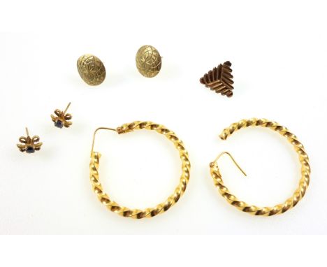 Pair of yellow metal hoop twist earrings, stamped "750", 7.2grs; pair of floral ear studs set topaz, stamped "9ct", gross 1g;