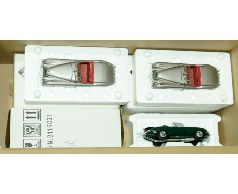 Franklin Mint &amp; Danbury Mint, a boxed group of 1:24 scale Jaguar models comprising of Franklin Mint 1961 Jaguar E-Type Co