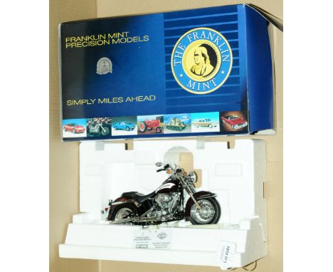 Franklin Mint, a boxed 1:10 scale Limited Edition Harley Davidson 2006 Heritage Softail Motorcycle. Comes with paperwork. No 