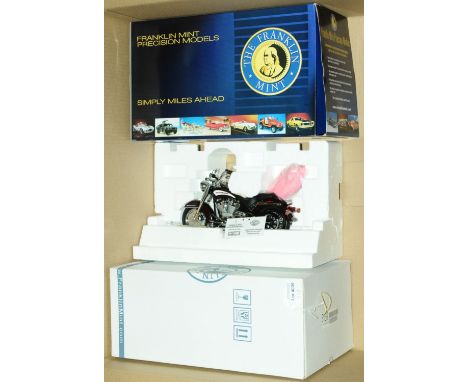 Franklin Mint, a boxed 1:10 scale B11E349 Limited Edition Harley Davidson Heritage Softail (2006) Motorcycle. Comes with pape