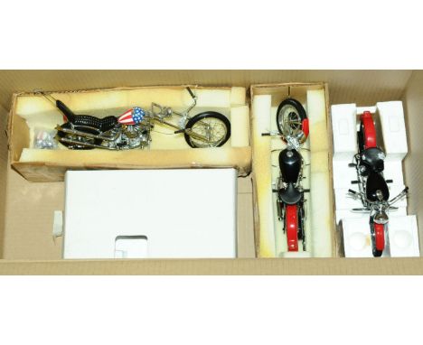 Franklin Mint, a part boxed group of 1:10 scale Harley Davidson Motorcycle models comprising of B11TQ07 Harley Davidson (1957