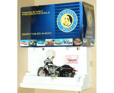 Franklin Mint, a boxed 1:10 scale Limited Edition Harley Davidson 2006 Heritage Softail Motorcycle. Comes with paperwork and 