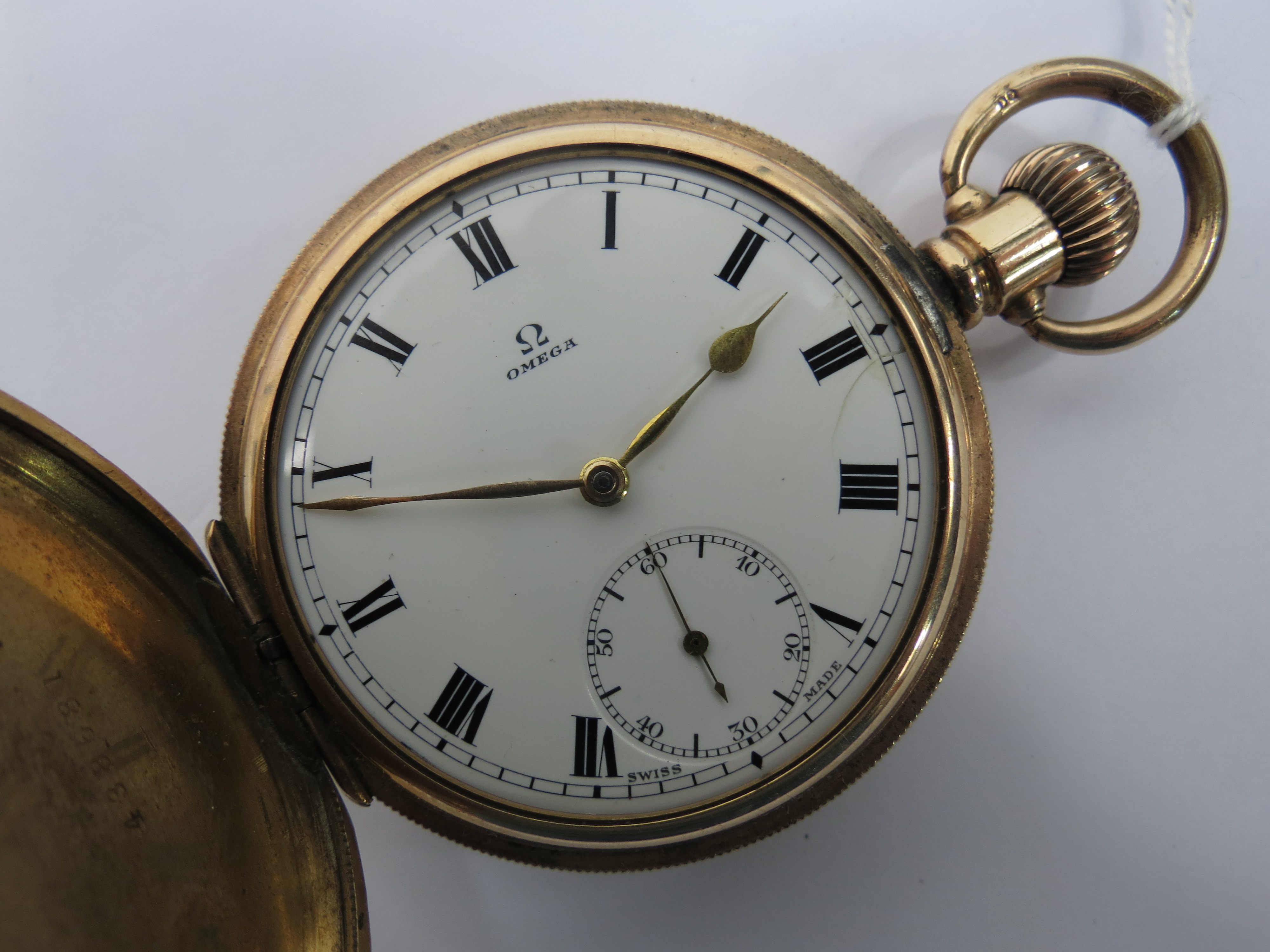 An Omega full hunter gold plated pocket watch in a Dennison star case