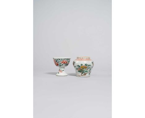 A CHINESE WUCAI JAR AND A STEM CUP 17TH CENTURYThe jar decorated with fruiting sprays of pomegranate and an iron-red hatched 