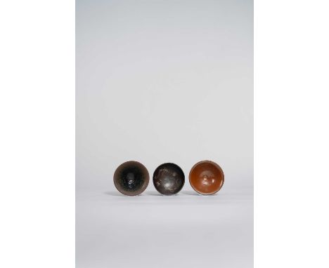THREE CHINESE STONEWARE BOWLS SONG DYNASTY  The first a brown-glazed bowl, probably Hebei province; with a lustrous russet su
