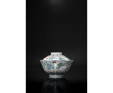 A RARE CHINESE DOUCAI 'BUTTERFLIES AND FLOWERS' BOWL AND COVER SIX-CHARACTER JIAQING MARKS AND OF THE PERIOD 1796-1820Delicat