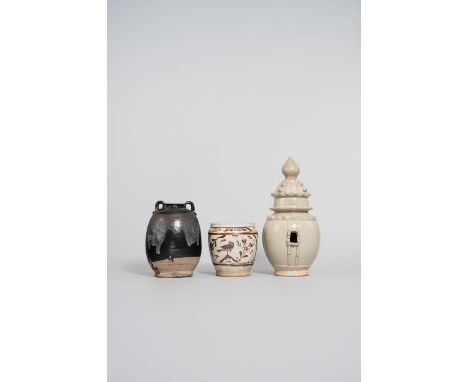 THREE CHINESE STONEWARE VESSELS TANG DYNASTY AND LATER  One a double-handled phosphatic-glazed jar, the black body with bluis