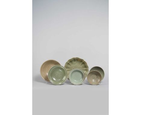 SIX CELADON SHALLOW BOWLS AND DISHESYUAN DYNASTY AND LATERComprising: two bowls with incised decoration, the larger with a ch