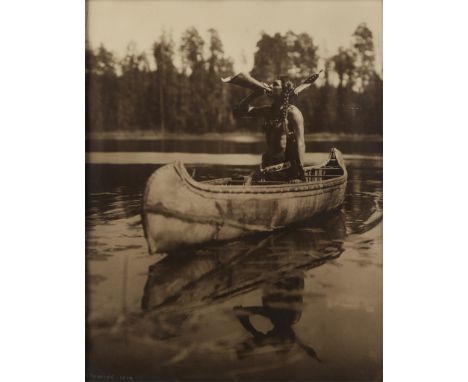 Roland W. Reed (American, 1864-1934). Gelatin silver print photograph titled "Moose Call - Ojibwe," depicting a figure in a c