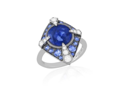 LANGI: A SAPPHIRE AND DIAMOND DRESS RINGThe oval brilliant step-cut sapphire weighing 2.92cts within collet-setting, to a sur