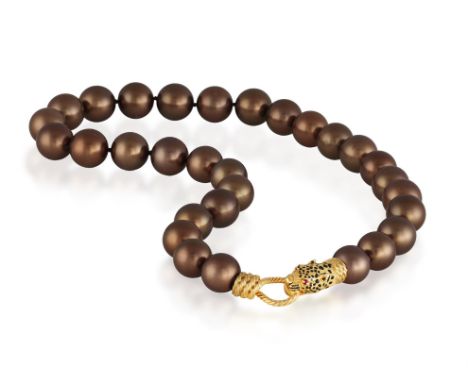 GAY FRÈRES: A CULTURED PEARL NECKLACE WITH ENAMEL AND RUBY CLASPComposed of a row of graduated cultured pearls measuring appr
