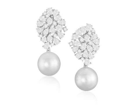 A PAIR OF CULTURED PEARL AND DIAMOND PENDENT EARRINGSEach round-shaped cultured pearl measuring approximately 12.86mm, suspen