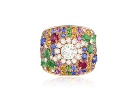A DIAMOND AND GEM-SET DRESS RINGThe wide band centring a brilliant-cut diamond weighing approximately 0.50ct within a similar