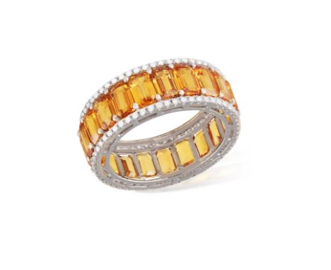 A SAPPHIRE AND DIAMOND ETERNITY RINGComposed of a continuous row of cut-cornered rectangular orange sapphires, between brilli