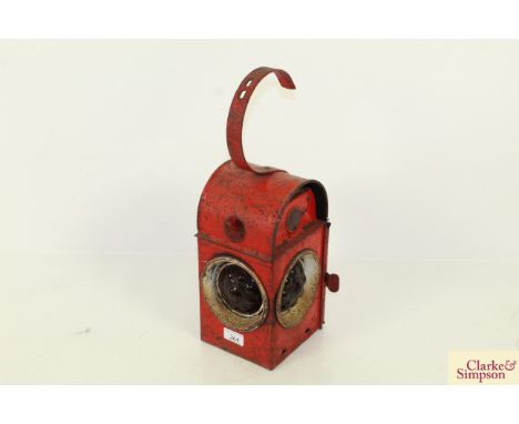 A red Kenyon road lamp