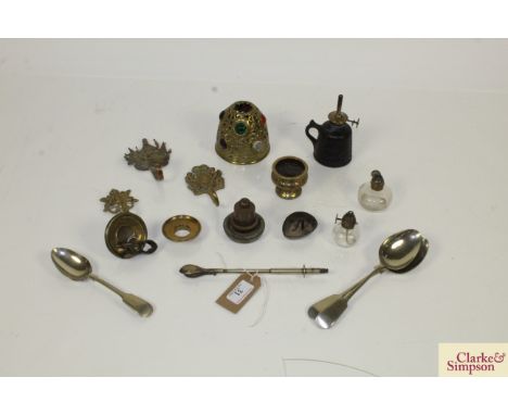 A collection of various metalware to include Wells Unbreakable House Lamp; plated spoons; decorative brass coat hooks etc.