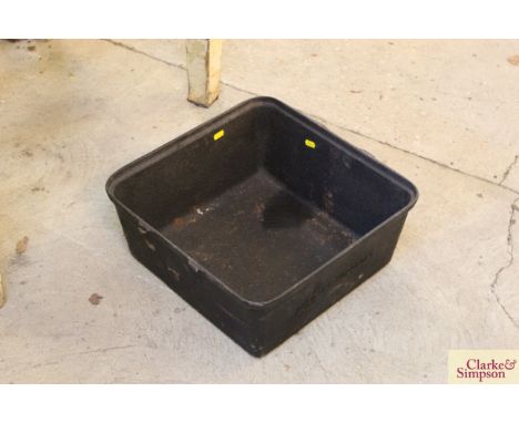 A cast iron metal planter