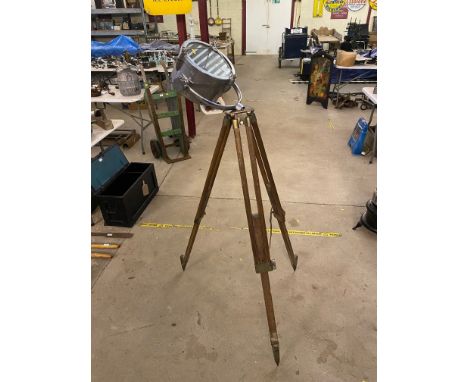 A Francis search light and an oak tripod