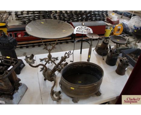 An antique brass trivet, an oval brass jardiniere, a brass stand, a light fitting etc.