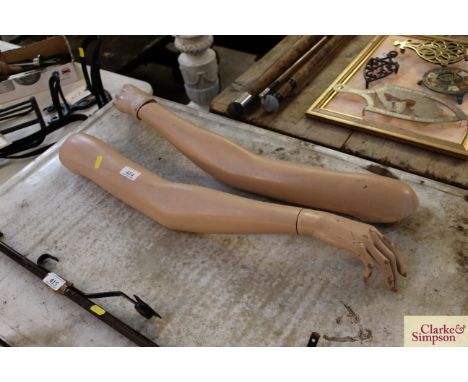A pair of mannequin window display arms 