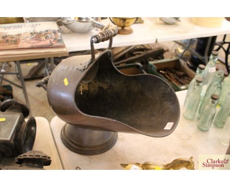 An antique copper coal helmet 