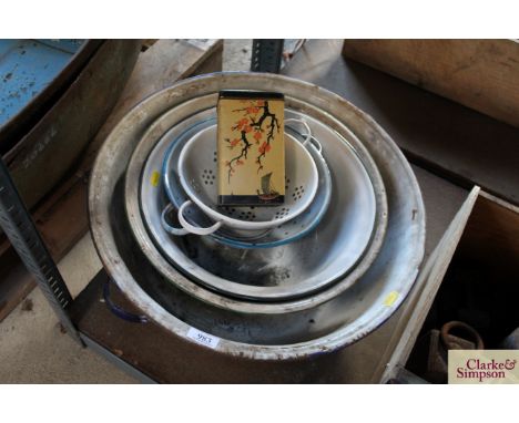 A collection of various enamel ware to include bowls and colanders 