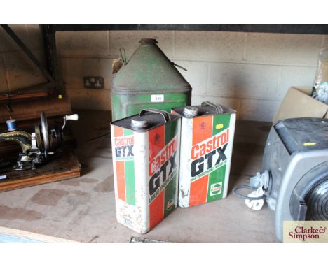 Two Castrol GTX fuel cans and a vintage BP fuel can 