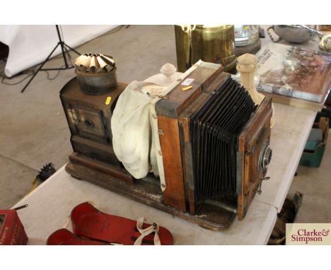 A vintage Magic Lantern projector with bellows action