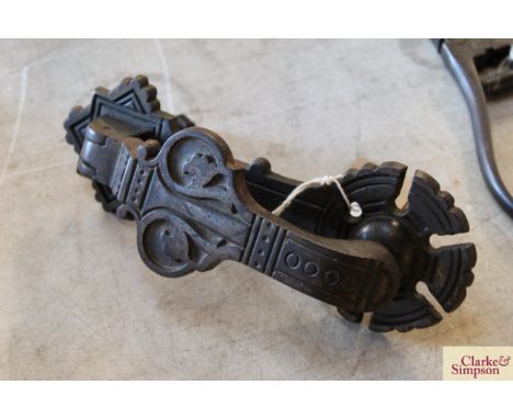 An ornate iron door knocker 