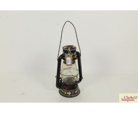 An early 20th Century painted bargeware hurricane lamp