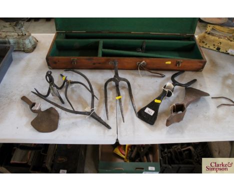 A quantity of tool heads to include adze, pitch fork, grappling iron etc. 