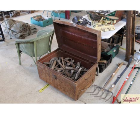 A tin trunk and contents of various wooden handled tools etc. 