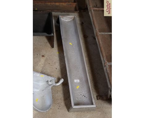 A painted metal ware trough
