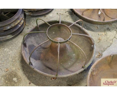 A circular iron pig trough complete with division bars 